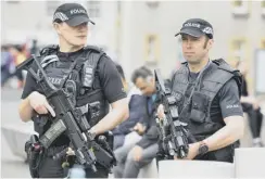  ??  ?? 0 Armed police at Holyrood after the Manchester terror attack