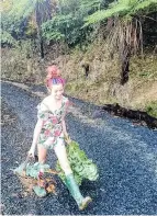  ?? PHOTO: WIN MARSHALL ?? Gardening duties . . . Isla Marshall (9) carries plants for her mum at home in Mt Cargill.