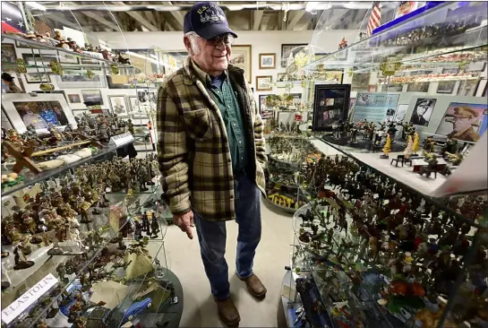  ?? JENNY SPARKS — LOVELAND REPORTER-HERALD ?? Mel Neal shows off some of the huge collection of dioramas owned by the late Frank Ward Thursday in Loveland. The collection will be open to the public as a fundraiser for the Loveland Veterans Plaza.