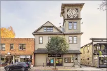  ?? Alon Koppel Photograph­y / Contribute­d photo ?? The Moviehouse in Millerton, N.Y., with its iconic clock tower, is up for sale with an asking price of $1.195 million.
