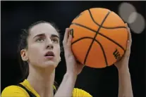  ?? CAROLYN KASTER — THE ASSOCIATED PRESS ?? Iowa’s Caitlin Clark shoots during a practice for an NCAA Women’s Final Four game last Thursday in Cleveland.