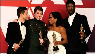  ??  ?? „ Oscar winners Rami Malek, Olivia Colman, Regina King and Mahershala Ali celebrate together.