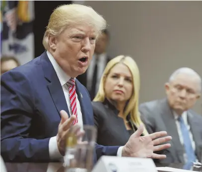  ?? AP PHOTO ?? CONFLICTIN­G AIMS: President Trump yesterday voices his support for raising the minimum age to buy AR-15 assault rifles, putting him at odds with the National Rifle Associatio­n on the issue.