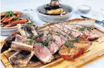  ??  ?? Avalon Steak & Seafood’s Tomahawk, 30-day aged prime, 36 ounce bone-in ribeye. AVALON STEAK & SEAFOOD/COURTESY