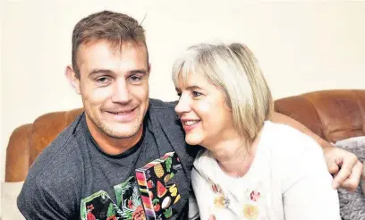  ??  ?? The Undateable­s star Tom Morgan, from Bridgend, pictured with his mum Elaine