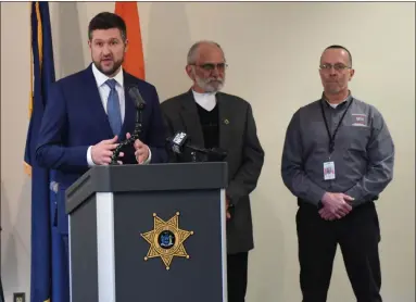  ?? TANIA BARRICKLO — DAILY FREEMAN ?? Ulster County Executive Pat Ryan, left, speaks during a press conference on Wednesday, March 11, at the Ulster County Law Enforcemen­t Center in Kingston, N.Y. With him are county Legislatur­e Chairman David Donaldson, center, and county Emergency Management Director Steven Peterson.