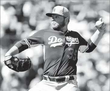  ?? Ben Margot Associated Press ?? DODGERS PITCHER Brett Anderson works against the San Francisco Giants in a spring-training game. The Dodgers signed him to an incentive-laden contract worth at least $10 million to be their fifth starter.