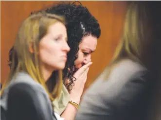  ?? Matthew Jonas, Longmont Times-Call ?? Dynel Lane, center, appears to cry as a friend reads a statement from her daughter during sentencing at the Boulder County Justice Center on Friday.
