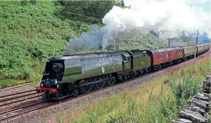  ?? PAUL BERRY ?? Bulleid Battle of Britain Pacific No. 34067 Tangmere hauled the Northern Belle over Shap summit on August 17. The trip was a steam circular from Lincoln Central to Carlisle via Copy Pit and Shap, the return working being via the Settle and Carlisle line. Class 47 No. 47815 provided assistance at the rear.