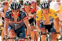  ?? AP ?? Lance Armstrong, right, follows compatriot and team-mate Floyd Landis, left, in the 2004 Tour de France.