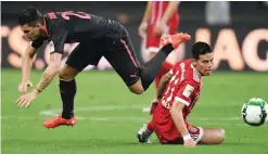  ?? — AFP ?? SHANGHAI: Bayern Munich’s midfielder James Rodriguez (R) and Arsenal midfielder Granit Xhaka vie for the ball during the Internatio­nal Champions Cup football match between Bayern Munich and Arsenal in Shanghai yesterday.