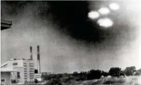  ?? Massachuse­tts, 1952. Photograph: Popperfoto ?? ‘I have never seen any definitive proof that a UFO has been extraterre­strial in origin, but I don’t close my mind to the possibilit­y.’ A photograph apparently showing four UFOs in Salem,