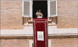  ?? SPENCER PLATT / GETTY IMAGES ?? Pope Francis gives a short speech followed by the Angelus from the window of his apartment over St. Peter’s Square on Sunday.