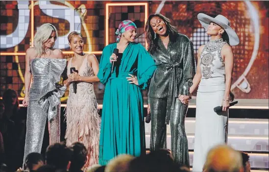  ?? Photograph­s by Robert Gauthier Los Angeles Times ?? A FORMIDABLE lineup of Lady Gaga, left, Jada Pinkett Smith, Alicia Keys, Michelle Obama and Jennifer Lopez gather onstage Sunday at Staples Center.