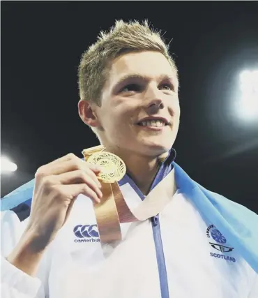  ??  ?? 0 Duncan Scott shows off his gold medal for the 100m freestyle. Top right, the men’s triple team celebrate their bowls victory. Above, cyclist Neah Evans, who won a silver medal