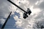  ??  ?? Workers of the electric repair brigade remove old cables in San German, Puerto Rico on Wednesday. Federal and Puerto Rican officials are preparing for another catastroph­e that cuts power for weeks or months.