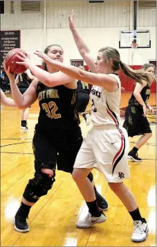  ?? TIMES photograph by Annette Beard ?? Lady Blackhawk Melissa Landis attempts to block a shot by a Lady Tiger from West Fork Tuesday, Jan. 3.