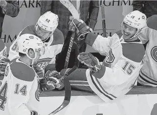  ?? POSTMEDIA NEWS ?? Montreal Canadiens' Jesperi Kotkaniemi, right, congratula­tes Nick Suzuki, left, after a goal in a playoff game against the Pittsburgh Penguins last season.