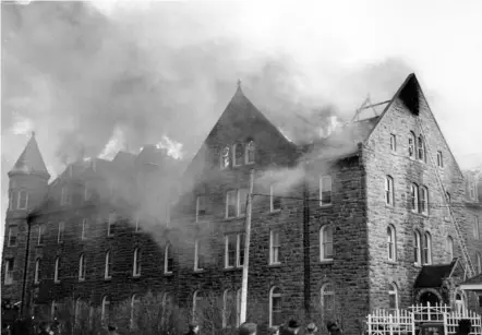  ?? RON ROELS /COURTESY OF NIAGARA FALLS PUBLIC LIBRARY ?? This is a photo taken on Nov. 25, 1967, when a fire destroyed the north wing, as well as a good portion of the chapel roof and interior ceiling at Mount Carmel in Niagara Falls.