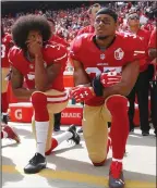  ?? NHAT V. MEYER/ TRIBUNE NEWS SERVICE ?? Colin Kaepernick, left, and Eric Reid kneel during the national anthem on Oct. 2, 2016, at Levi's Stadium in Santa Clara.