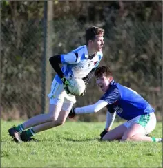  ??  ?? Defender Dylan O Núalláin gives Jack Dunne the slip.