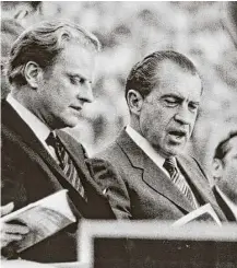  ?? Associated Press ?? Evangelist Billy Graham, left, frequently ministered to U.S. leaders. In 1970, President Richard Nixon joined him onstage at one of his 75,000-strong crusades.