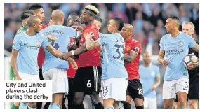  ??  ?? City and United players clash during the derby