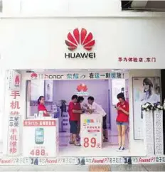  ?? Bloomberg ?? Focus on innovation A Huawei Technologi­es Co store in Shenzhen, China. In the region, Huawei has tied up with Zain Kuwait and Saudi Aramco, among others, to open innovation centres.