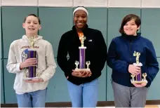 ?? (Courtesy of the El Dorado School District/Special to the News-Times) ?? From left, Washington Middle School fifth-grader Alex Flowers, Strong-Huttig eighth-grader JaNaira Hamilton and WMS fifth-grader Kaden Hetrick were the first-, second- and third-place winners, respective­ly, of the Union County Spelling Bee held Friday, Feb. 17.