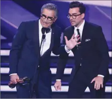  ?? The Canadian Press ?? Eugene and Daniel Levy, seen here accepting a Canadian Screen Award, are now Emmy winners, too, after Schitt’s Creek swept the comedy categories Sunday night.