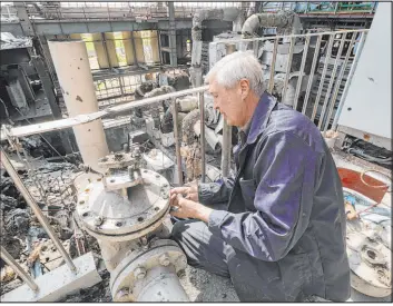  ?? Andrii Marienko The Associated Press ?? A worker Friday repairs a thermal power plant recently destroyed by Russian missiles near Kharkiv, Ukraine. Ukraine has pleaded with allies to send more Patriot systems.