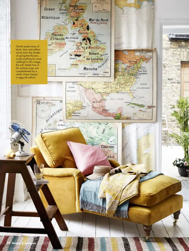  ??  ?? Gentle pastel tones of blush, blue and yellow, which echo the shades of springtime flowers… could anything be more uplifting? In this image, the soft, faded tints of the antique maps are complement­ed by a velvet chaise longue in egg-yolk yellow.