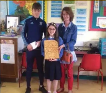  ??  ?? The winner of the Kerry McKeon school’s Essay writing competitio­n was Gráinne O’Beirne, St Ronan’s National School Cloonloo. (L-R) Danny Brennan, Gráinne O’ Beirne winner and Mary McKeon, Sponsors.