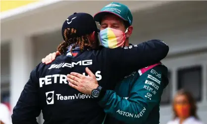  ?? Photograph: Dan Istitene/Formula 1/Getty Images ?? Lewis Hamilton and Sebastian Vettel embrace at the Hungarian Grand Prix on Sunday.