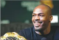  ??  ?? Jones smiles at comment during the Jan. 31 news conference. He is listed as an overwhelmi­ng favorite in his UFC 235 fight March 2.