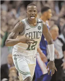  ?? STAFF PHOTOS BY MATT STONE ?? CAN’T KEEP THEM DOWN: Terry Rozier celebrates a 3-pointer during the fourth quarter of last night’s Game 2 of the Eastern Conference semifinals at the Garden. The Celtics overcame a 22-point first-half deficit for a 108-103 victory, punctuated by a...