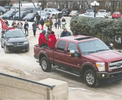  ?? BRANDON HARDER ?? Marchers pushing for the province to take action against forced sterilizat­ions of Indigenous women arrive at the legislatur­e Tuesday.