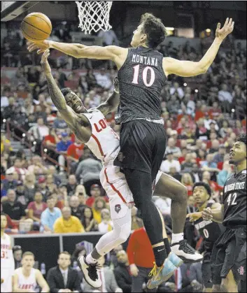  ?? Erik Verduzco Las Vegas Review-Journal @Erik_Verduzco ?? New Mexico guard Antino Jackson, left, is fouled by San Diego State forward Max Montana in the second half of the Mountain West tournament final on Saturday.