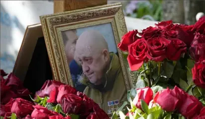  ?? Dmitri Lovetsky/Associated Press ?? A portrait of Wagner Group’s chief Yevgeny Prigozhin, who died in a plane crash two months after launching his brief rebellion.