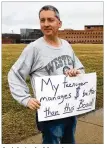  ?? MAX FILBY / STAFF ?? A picketer holds a sign near an entrance to Wright State University’s campus. The school’s faculty union has been on strikefor more than two weeks now.