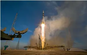  ?? GETTY ?? A Soyuz booster rocket launches a spacecraft from Kazakhstan’s Baikonur Cosmodrome last month. Gwynne Dyer writes that models of a ‘space drive’ which burns no fuel have the space community excited about the possibilit­y of interstell­ar travel.
