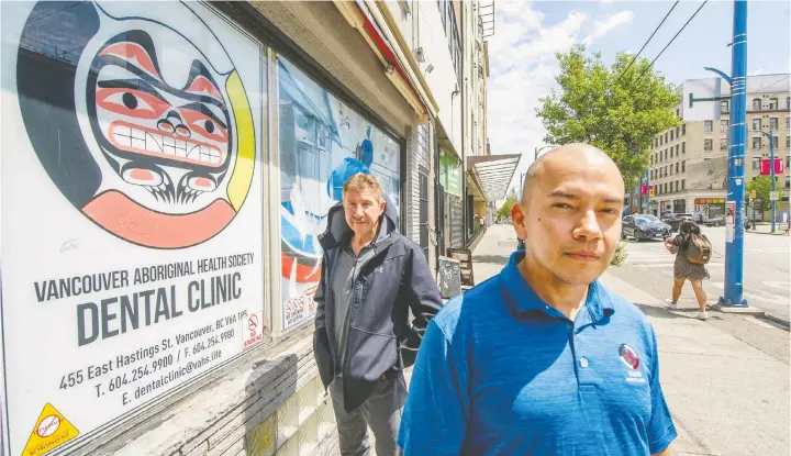  ?? ARLEN REDEKOP ?? Clinic manager Lex Vides, right, and Leonard Laboucan stand outside the Vancouver Aboriginal Health Society. The society's dental clinic serves vulnerable people in the Downtown Eastside, especially those who have no money or dental coverage. The clinic can't keep up with demand and is seeking financial support.