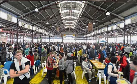  ??  ?? Star attraction: The crowd at the ‘Durian and Fruit Party’ at Queen Victoria Market in Melbourne.