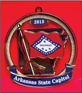  ?? Photo courtesy of Arkansas secretary of state ?? The 2015 Arkansas State Capitol Christmas ornament features the state flag. Capitol ornaments, issued through the secretary of state’s office, are an 11-year tradition.