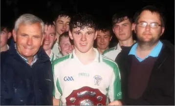  ??  ?? Billy Wickham of Cloughbawn receives the shield from Bobby Goff and Dean Goodison.