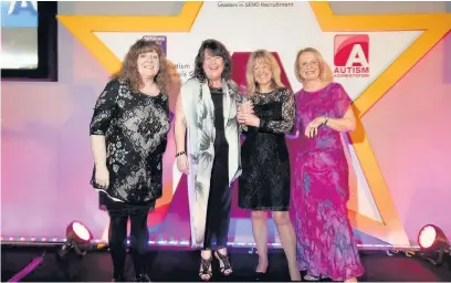  ??  ?? ●● Open 2 Autism representa­tives collecting the Award for Outstandin­g Health Services from hosts Janey Godley (far left) and Janet Corcoran (far right)