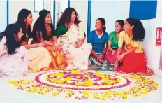  ??  ?? Students of GEMS Our Own Indian School in Dubai share a light moment during Onam celebratio­ns.