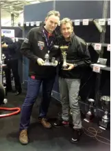  ??  ?? NMM director James Hewing receives the Frank Farrington Lifetime Achievemen­t Award from former World Superbike Champion Troy Bayliss.