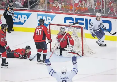  ?? AP PHOTO ?? Toronto Maple Leafs forward Kasperi Kapanen, right, celebrates his game-winning goal Saturday in double overtime against the Washington Capitals.
