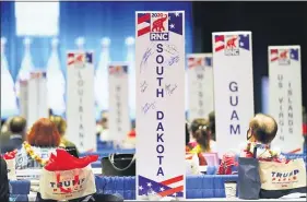  ?? ANDREW HARNIK — THE ASSOCIATED PRESS FILE ?? Delegates watch as the roll call vote of states continues after Vice President Mike Pence spoke at the 2020 Republican National Convention in Charlotte, N.C.